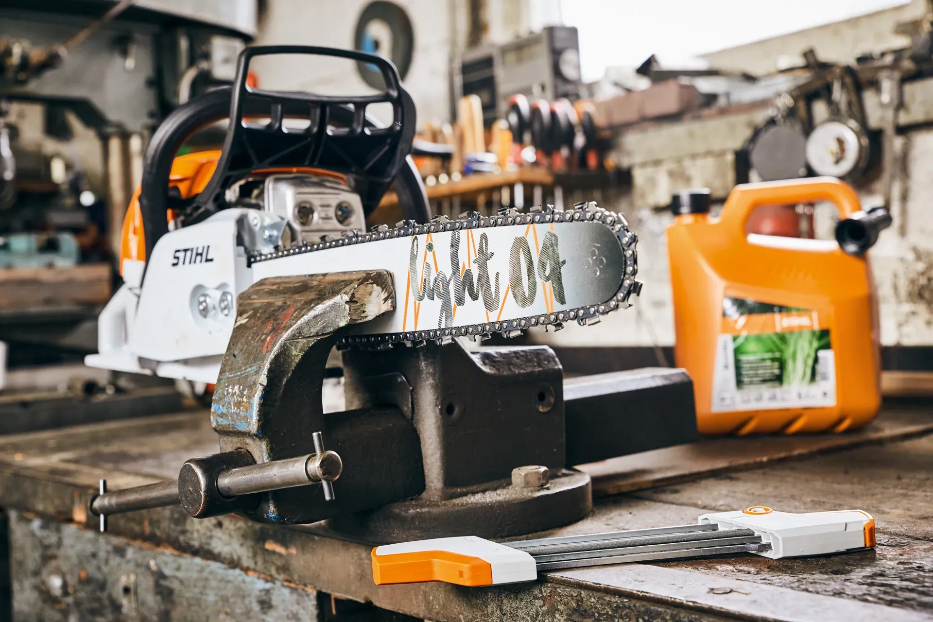 Close-up of a sharp STIHL chainsaw cutting cleanly through wood
