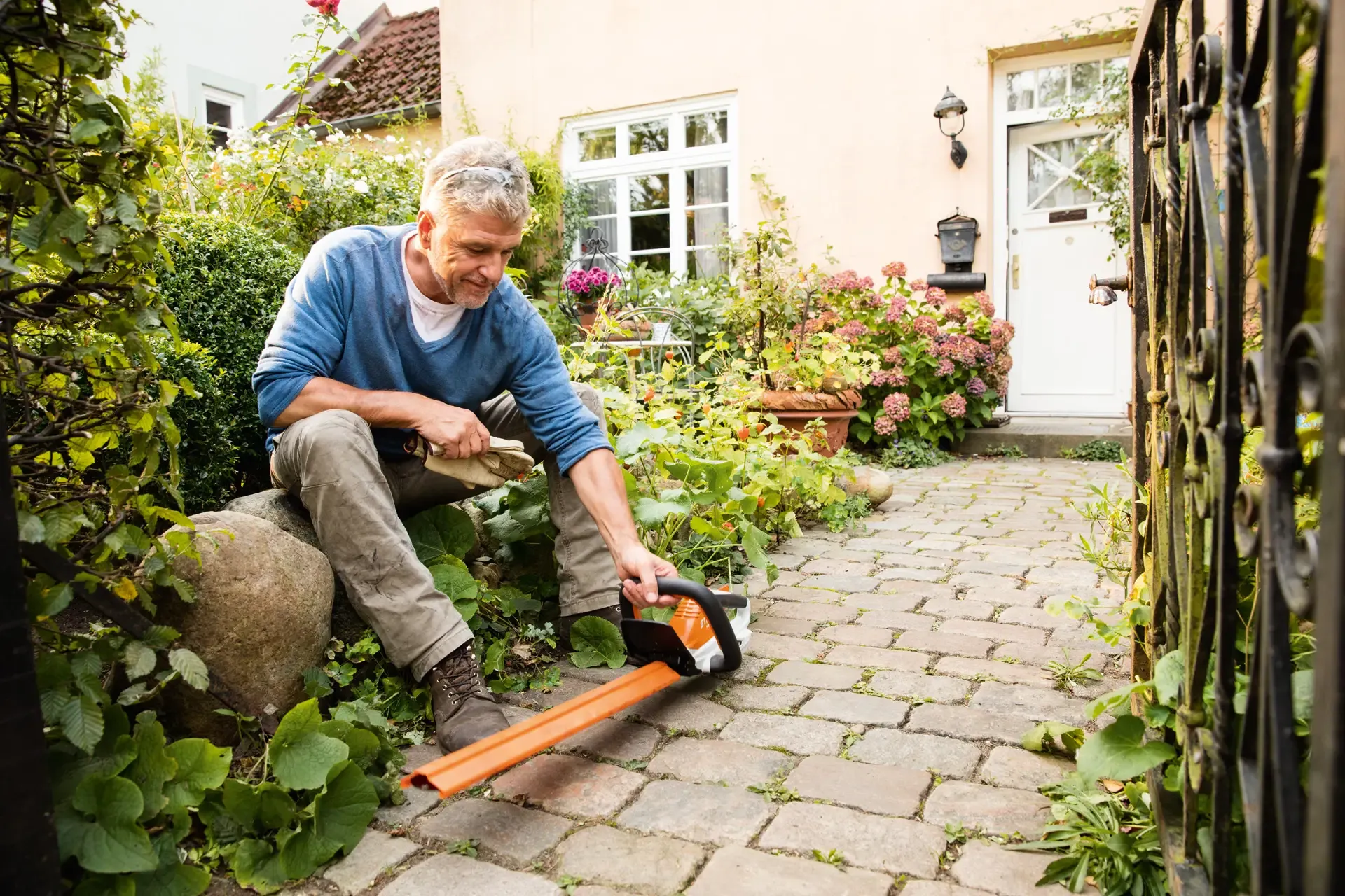Compact garden tools and equipment arranged in a small urban garden space